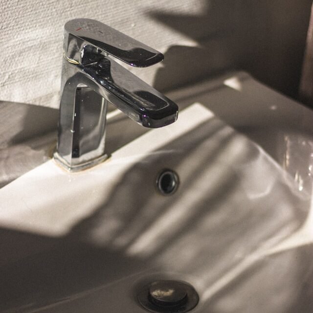 faucet and sink with shadows